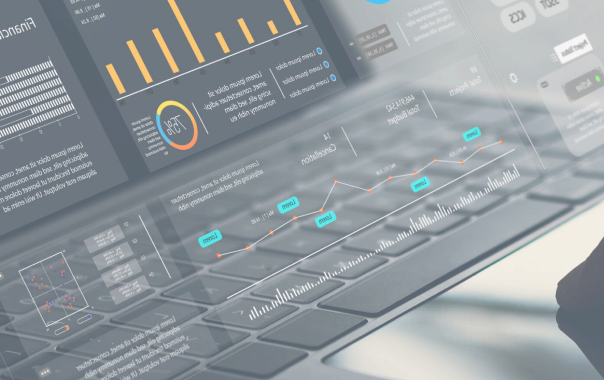 A laptop keyboard with transparent excel data charts, graphs, and analytics projected above the keys.